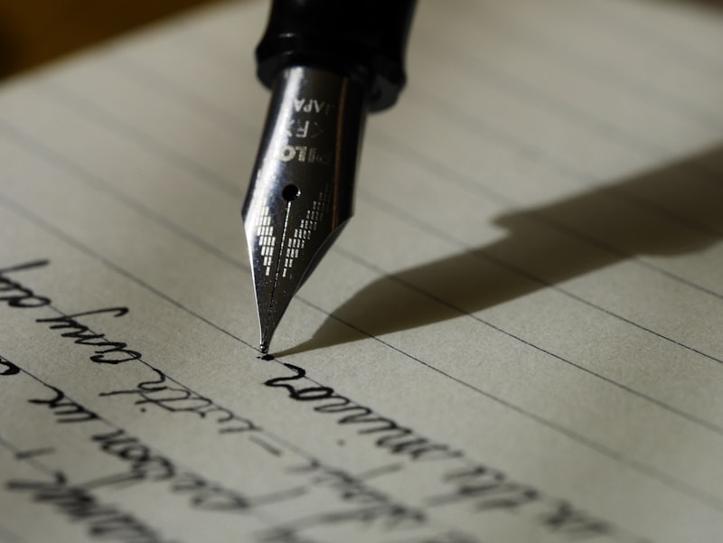 Handwritten letter pages with ink pen on cream paper