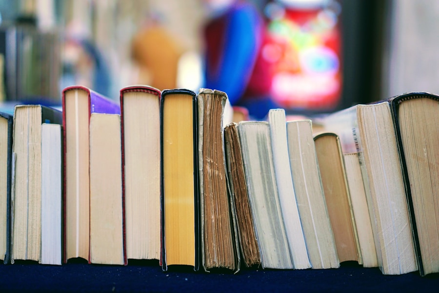 Stack of books with one spine facing out on a wooden table